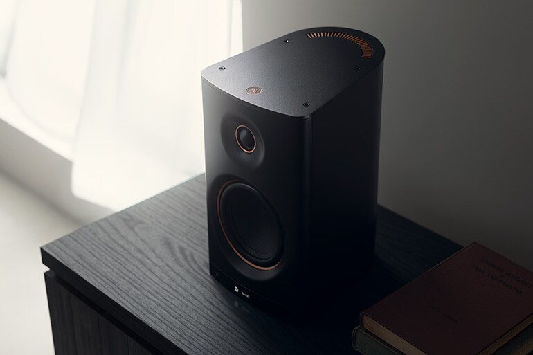Close‑up of the NX‑70A on a black shelf